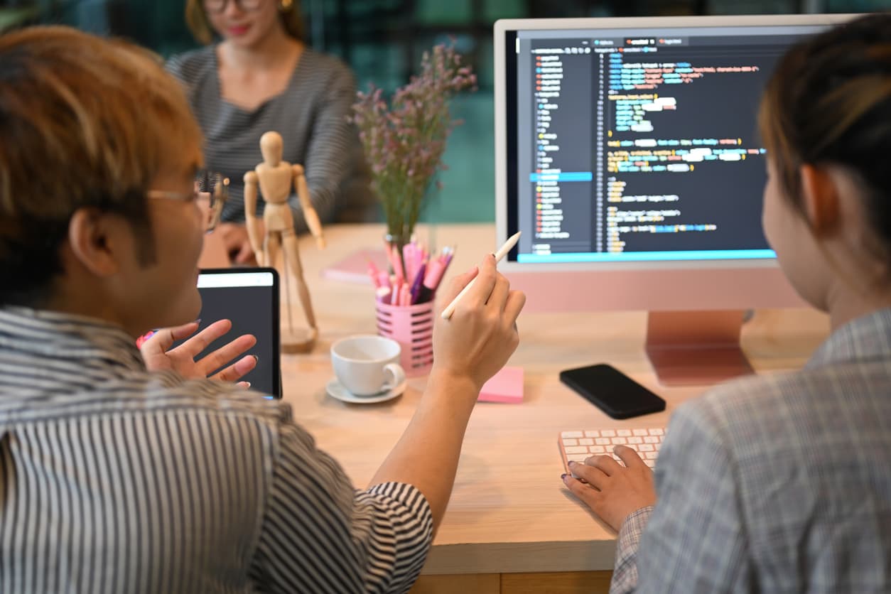 A pair programming session with two persons and the AI helping each other